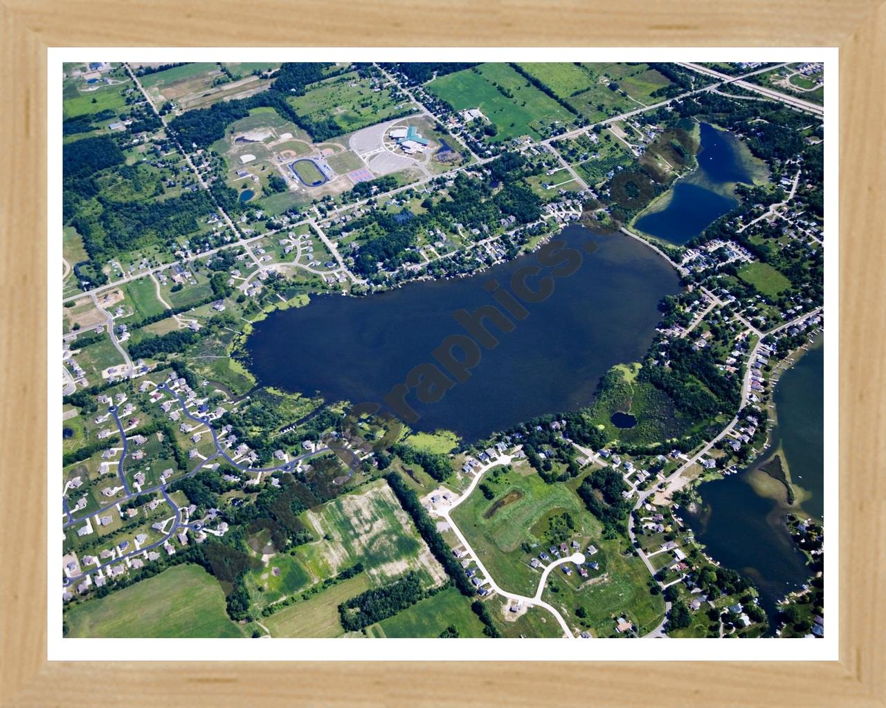 Aerial image of [4675] Loon Lake in Geness, MI with Natural Wood frame