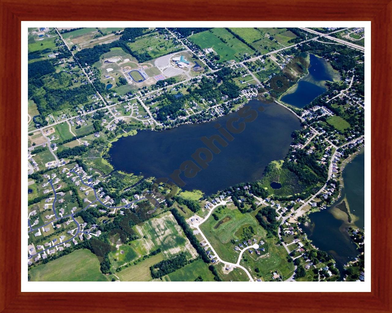 Aerial image of [4675] Loon Lake in Geness, MI with Cherry Wood frame