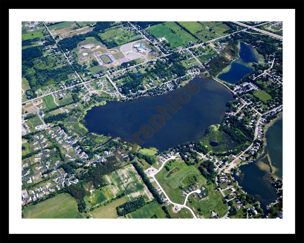 Aerial image of [4675] Loon Lake in Geness, MI with Black Metal frame