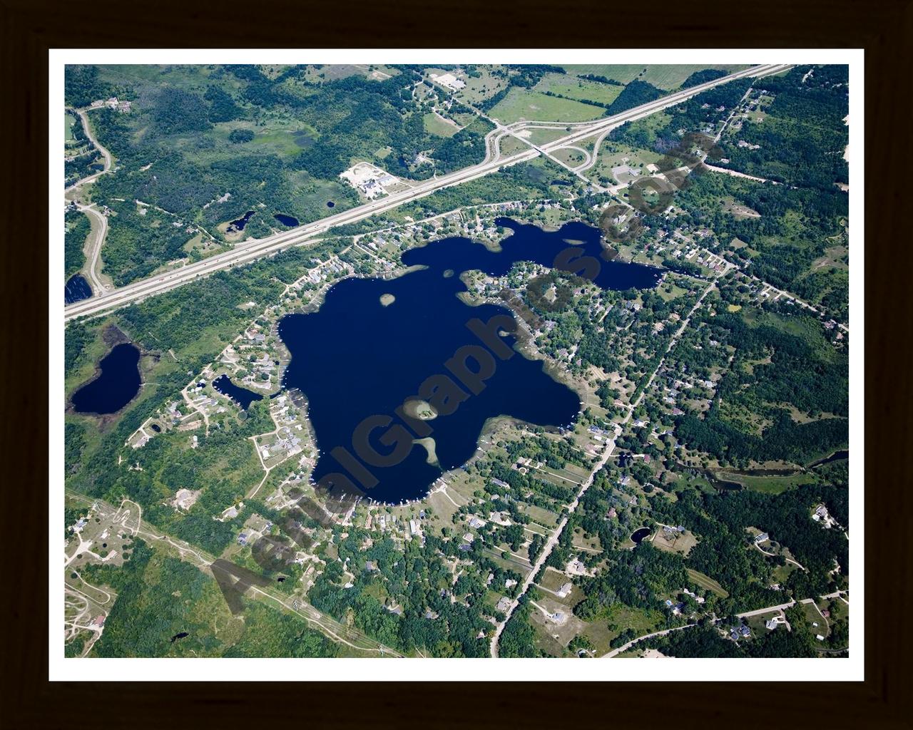 Aerial image of [4680] Runyan Lake in Livingston, MI with Black Wood frame