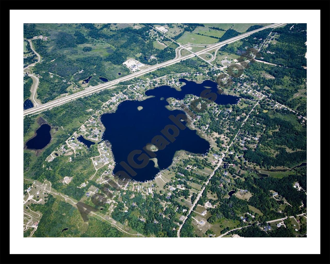 Aerial image of [4680] Runyan Lake in Livingston, MI with Black Metal frame