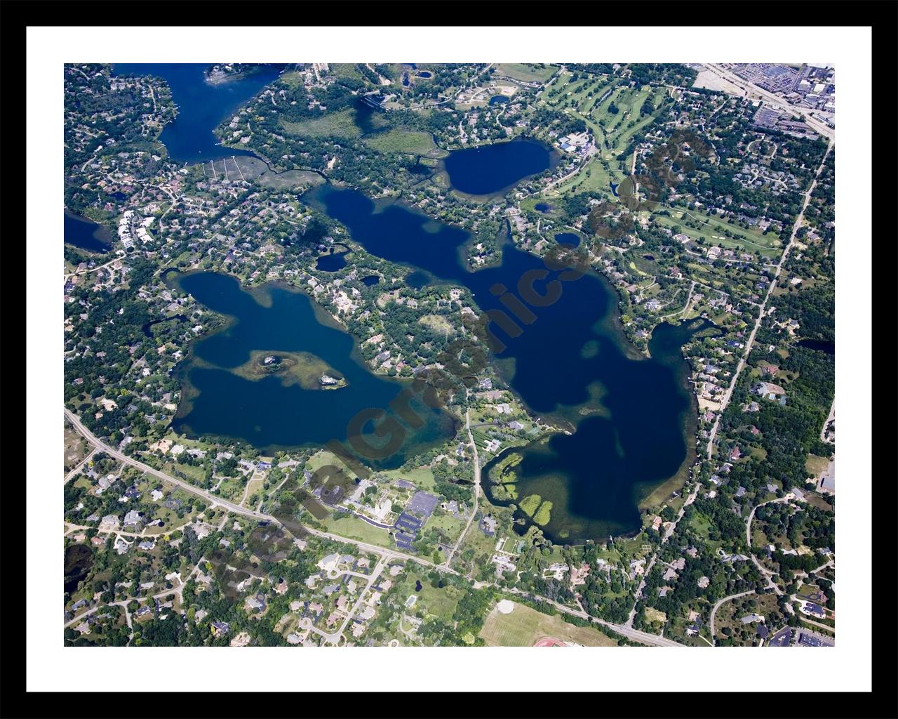 Aerial image of [4700] Lower Long Lake & Island Lake in Oakland, MI with Black Metal frame