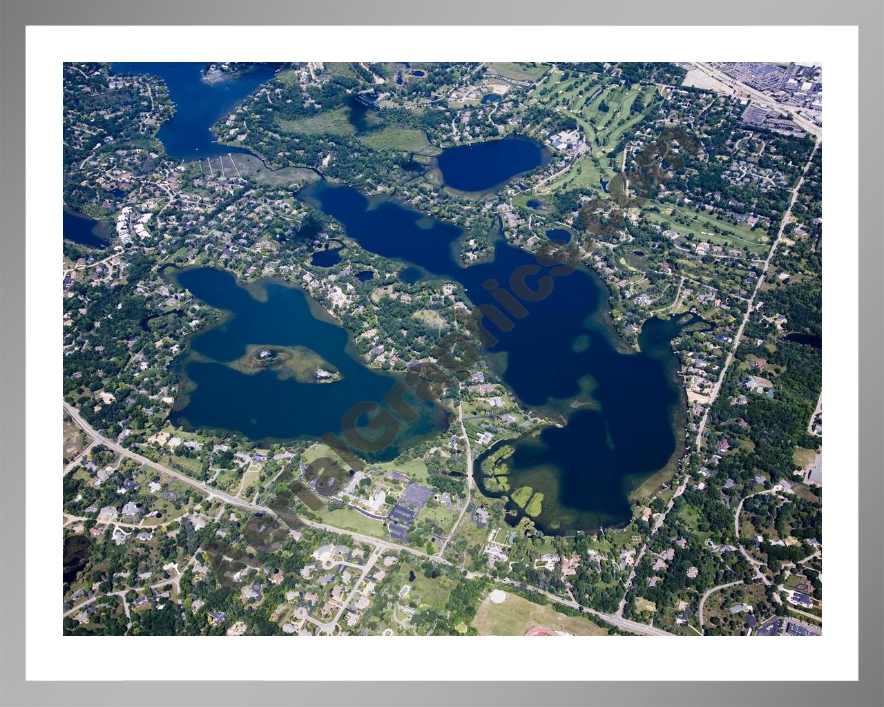 Aerial image of [4700] Lower Long Lake & Island Lake in Oakland, MI with Silver Metal frame