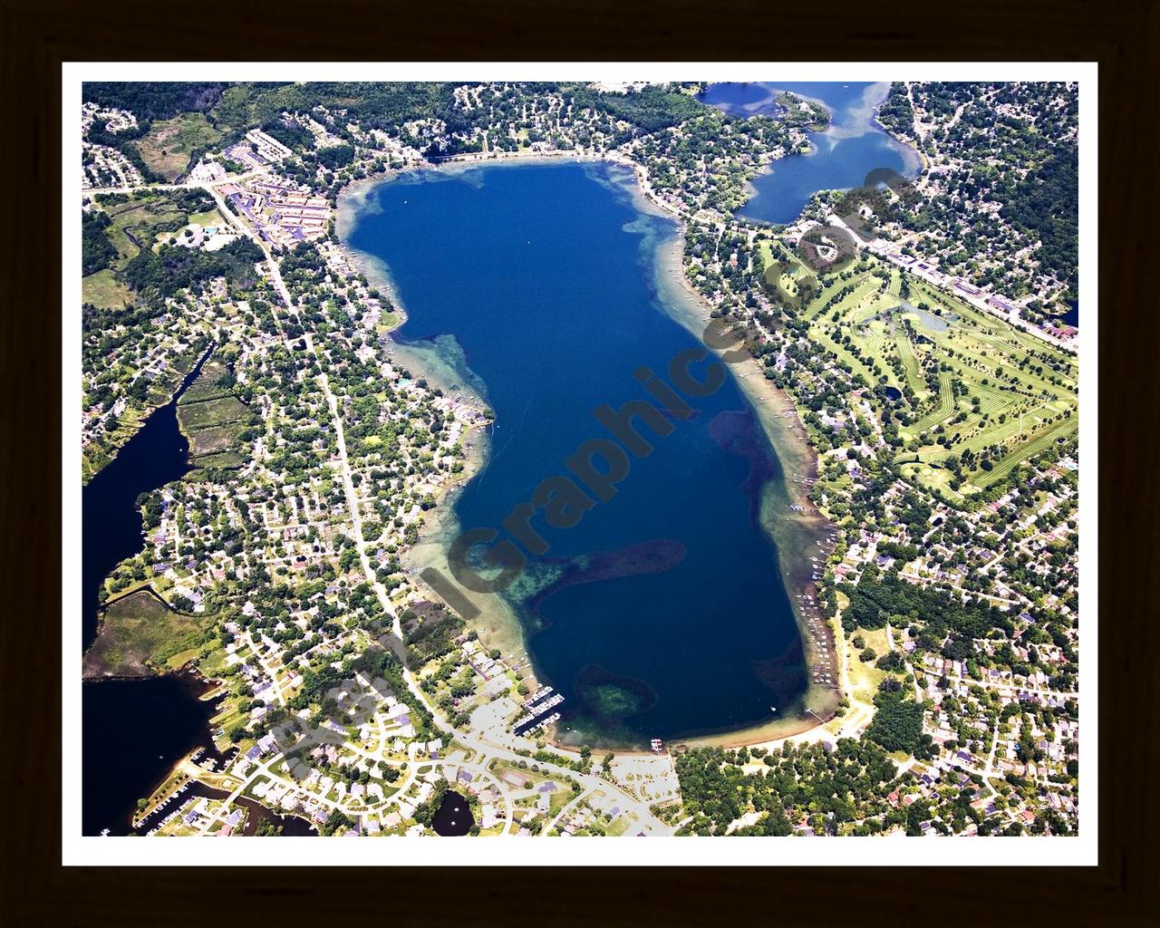 Aerial image of [4702] Elizabeth Lake in Oakland, MI with Black Wood frame