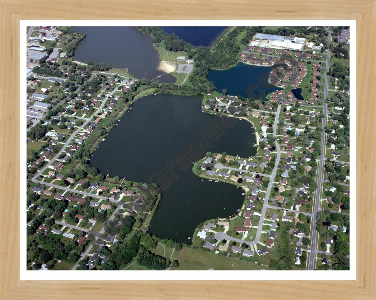 Aerial image of [4925] Rushmore Lake in Ottawa, MI with Natural Wood frame