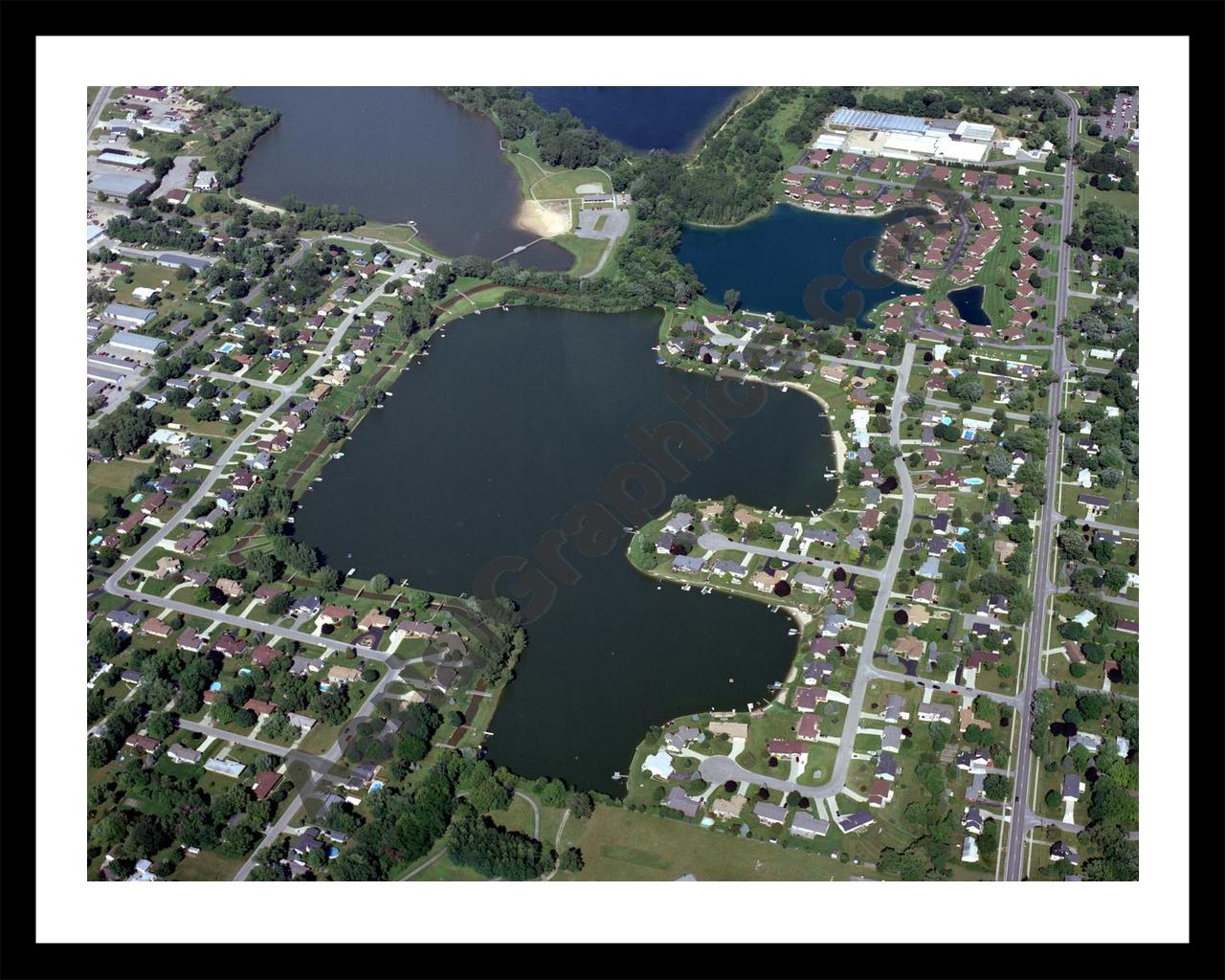 Aerial image of [4925] Rushmore Lake in Ottawa, MI with Black Metal frame