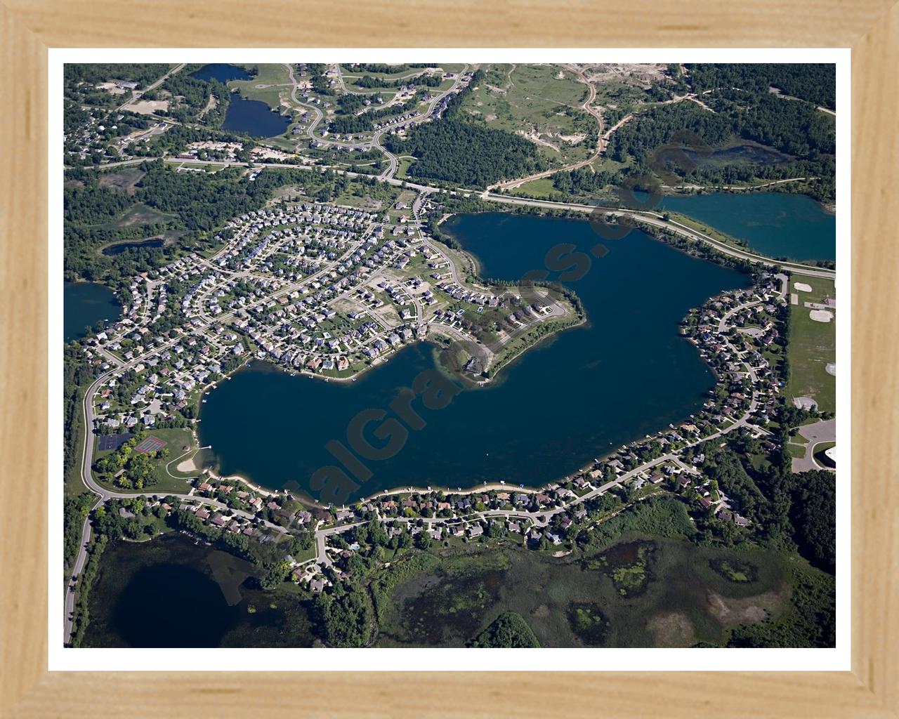 Aerial image of [4956] Oxford Lake in Oakland, MI with Natural Wood frame