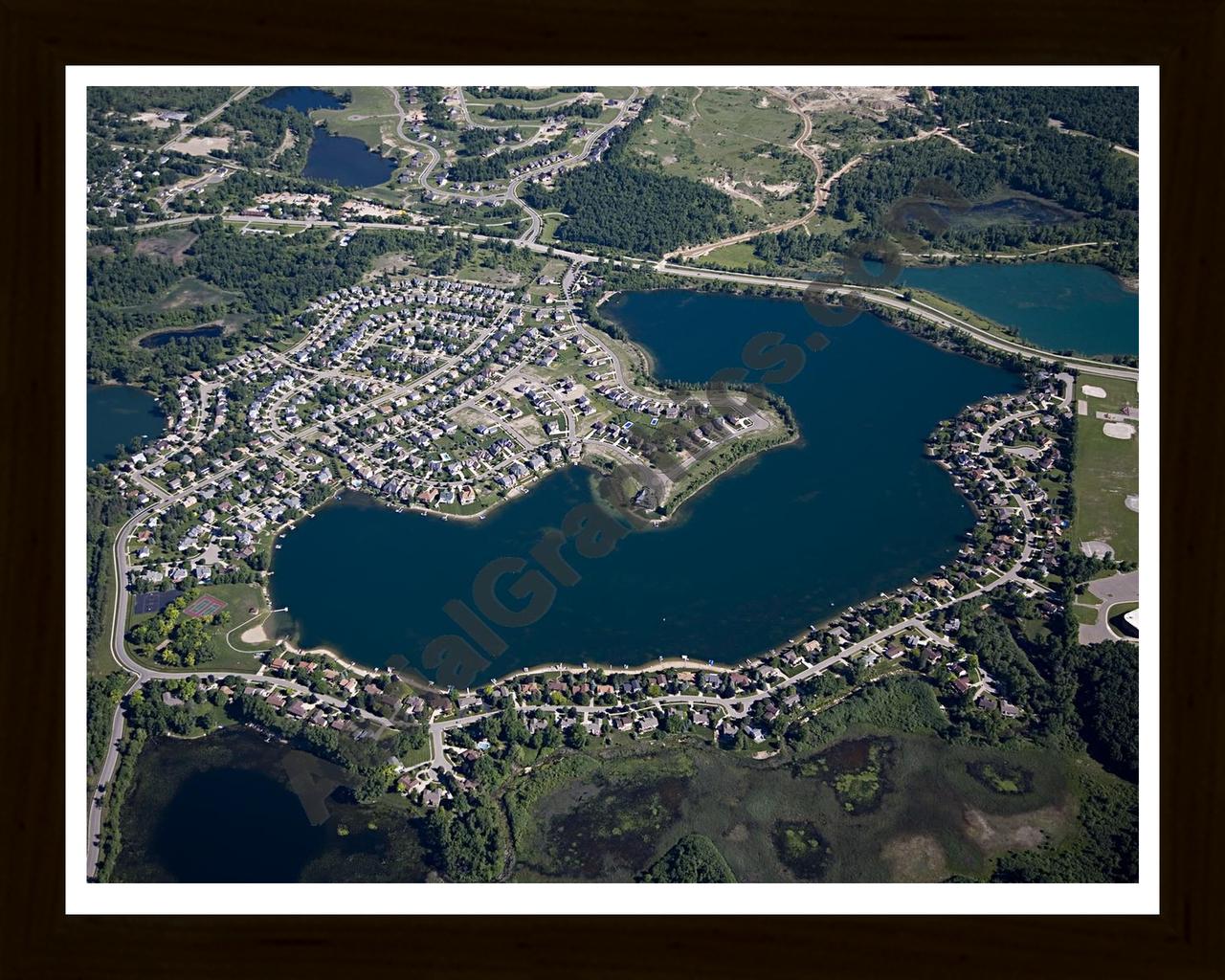 Aerial image of [4956] Oxford Lake in Oakland, MI with Black Wood frame