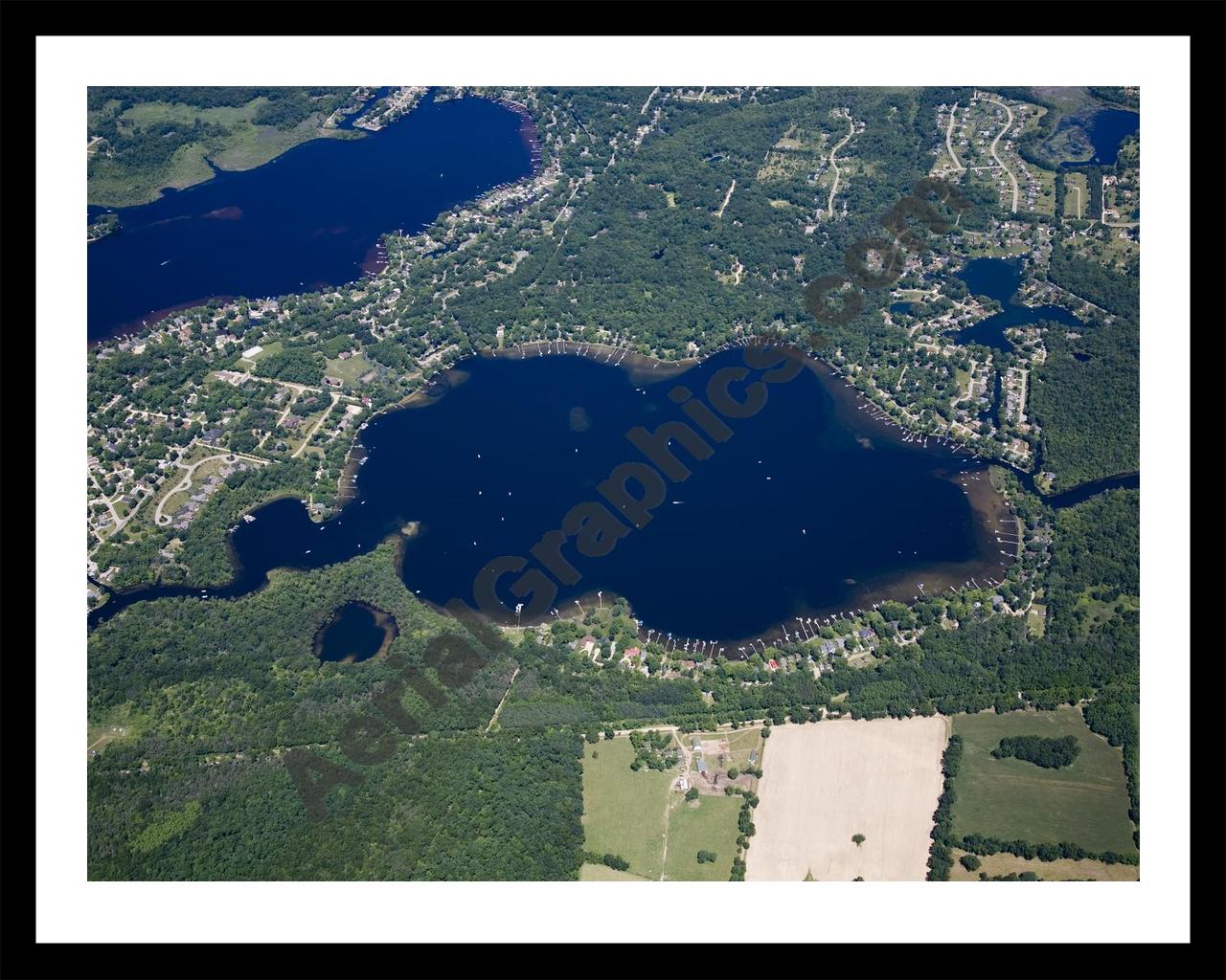 Aerial image of [4977] Base Line Lake in Livingston, MI with Black Metal frame