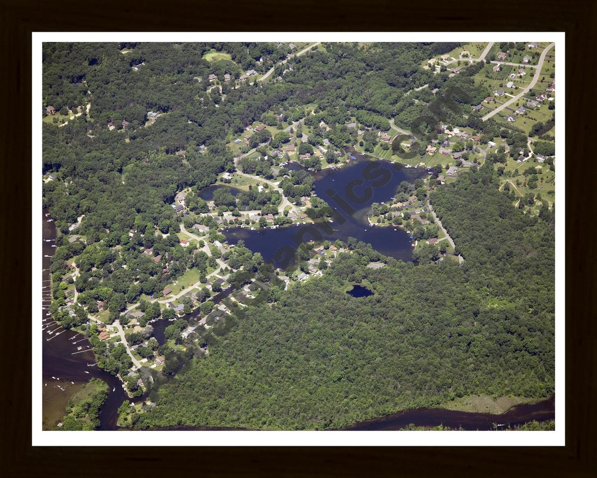 Aerial image of [4978] Tamarack Lake in Livingston, MI with Black Wood frame