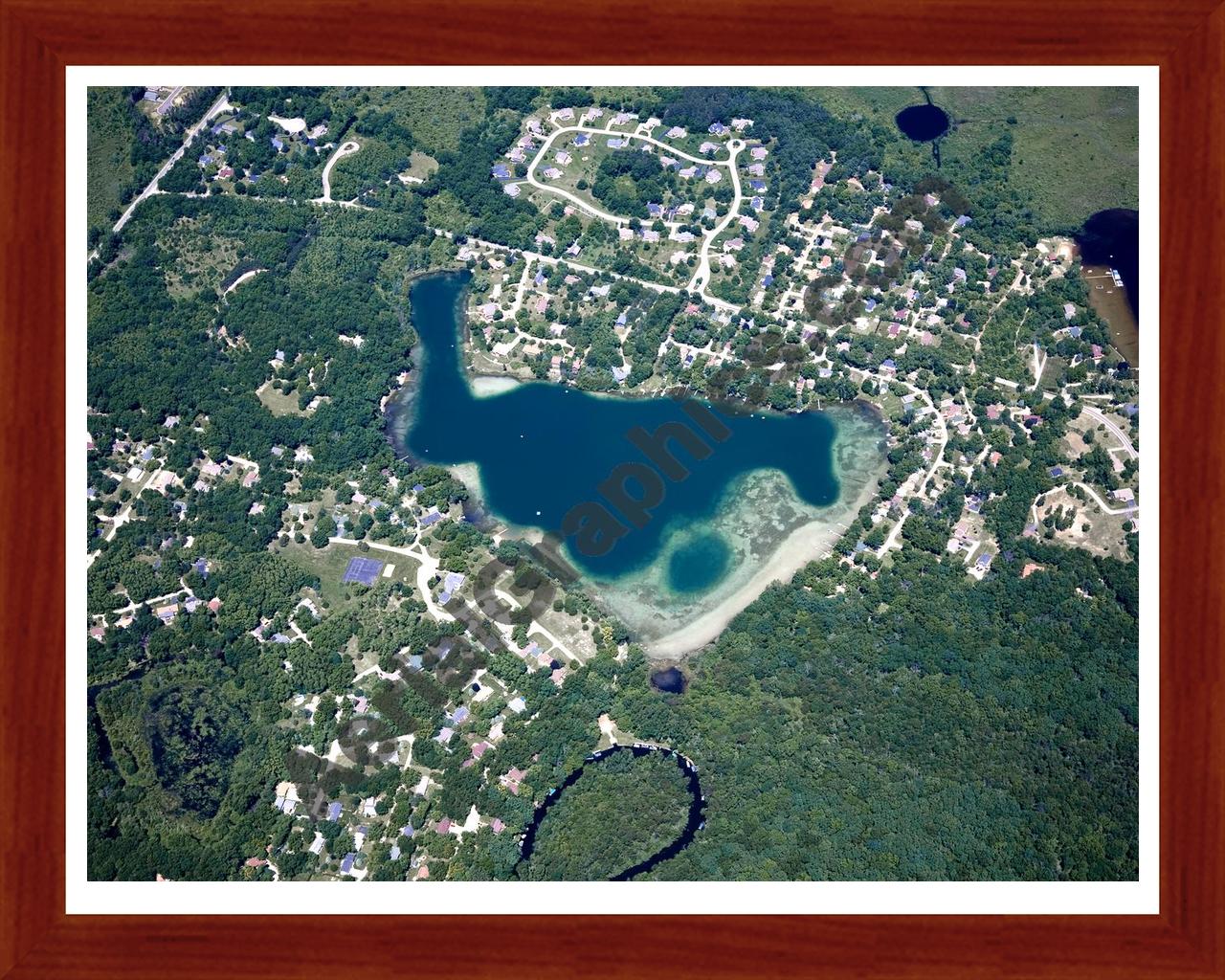 Aerial image of [4988] Cordley Lake in Livingston, MI with Cherry Wood frame