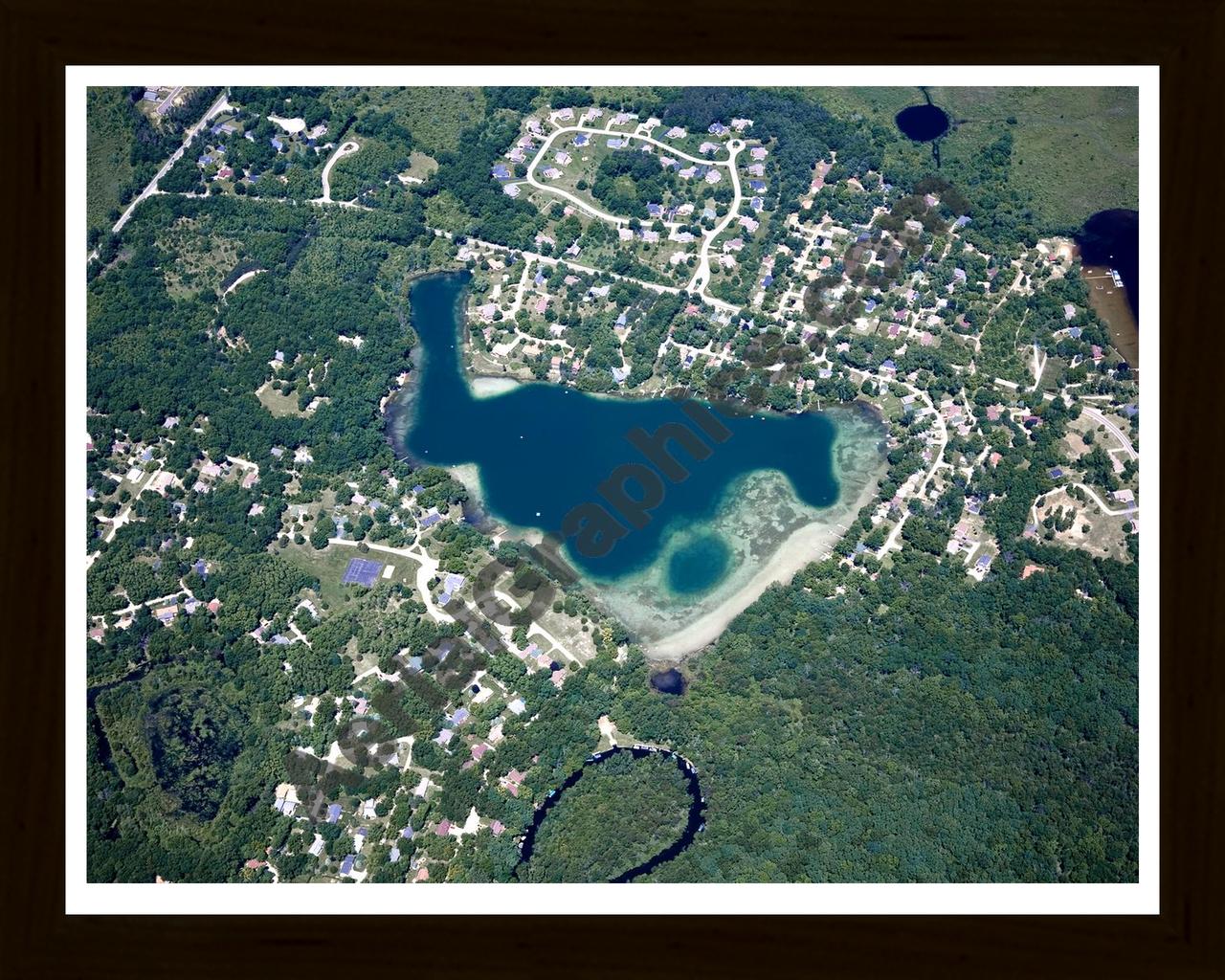 Aerial image of [4988] Cordley Lake in Livingston, MI with Black Wood frame