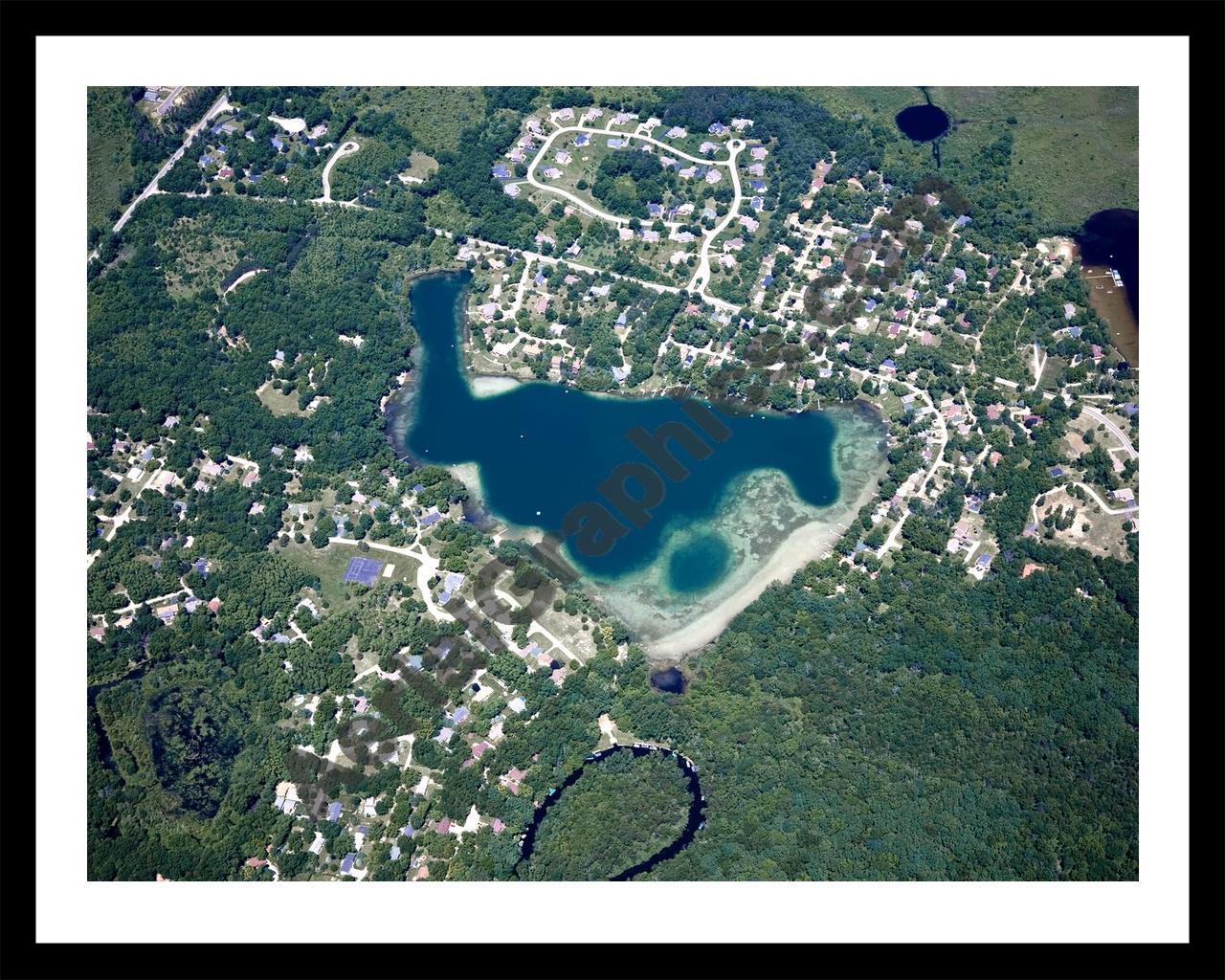 Aerial image of [4988] Cordley Lake in Livingston, MI with Black Metal frame