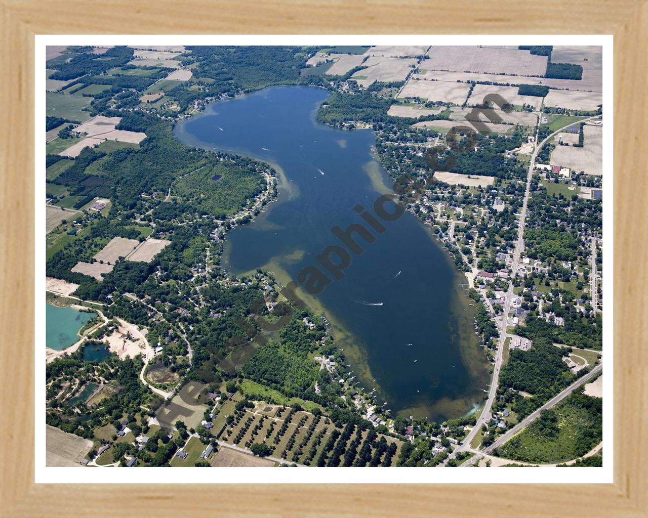 Aerial image of [4994] Jordan Lake in Ionia, MI with Natural Wood frame