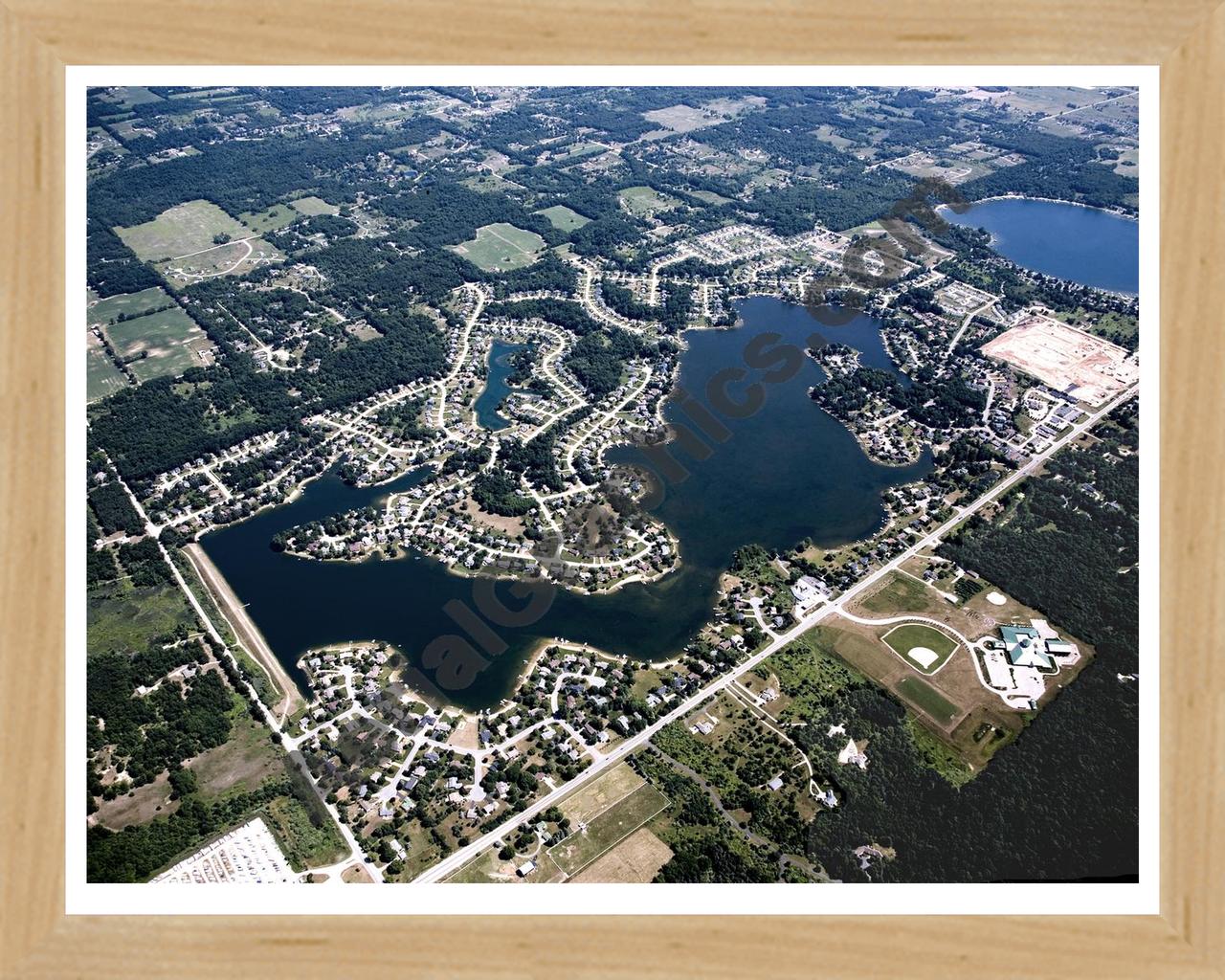 Aerial image of [4998] Lake Bella Vista in Kent, MI with Natural Wood frame