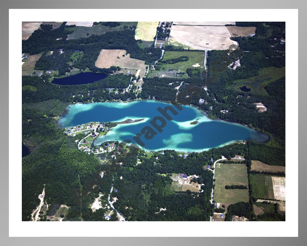 Aerial image of [5010] Burgess Lake in Montcalm, MI with Silver Metal frame