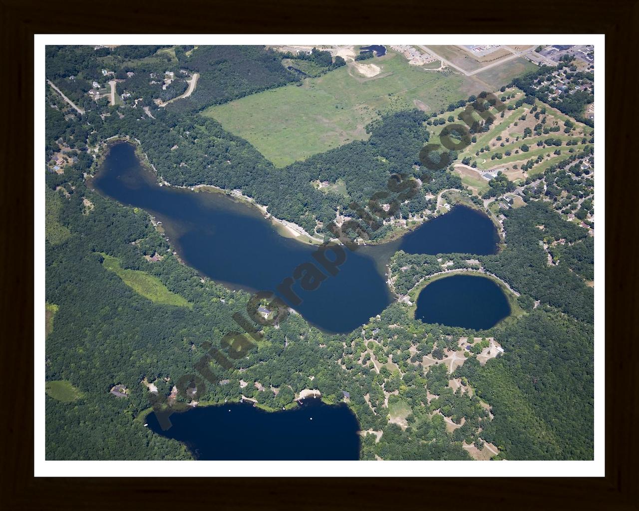 Aerial image of [5011] Baldwin Lake in Montcalm, MI with Black Wood frame