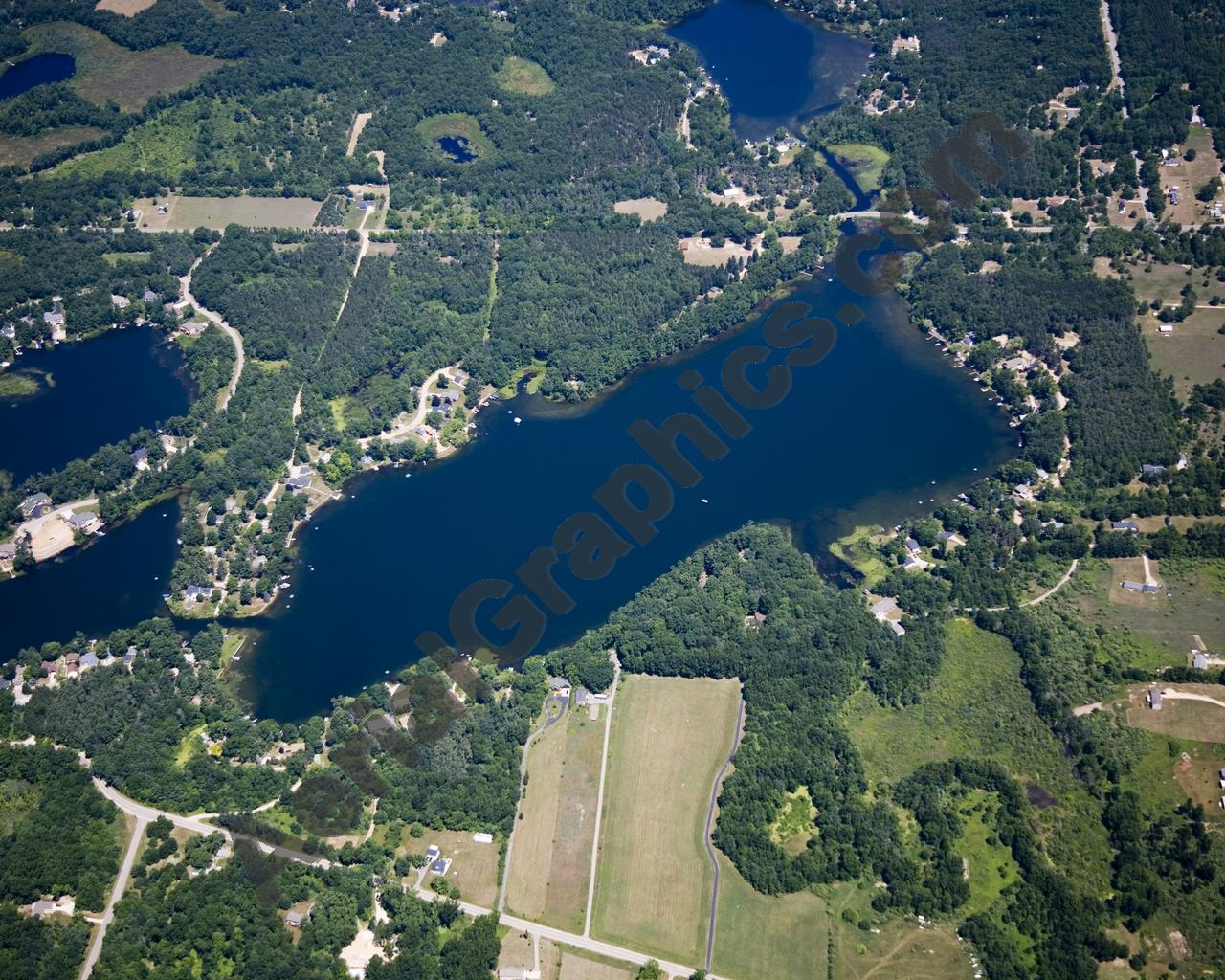 Aerial image of [5014] Woodbeck Lake in Kent, MI with Canvas Wrap frame