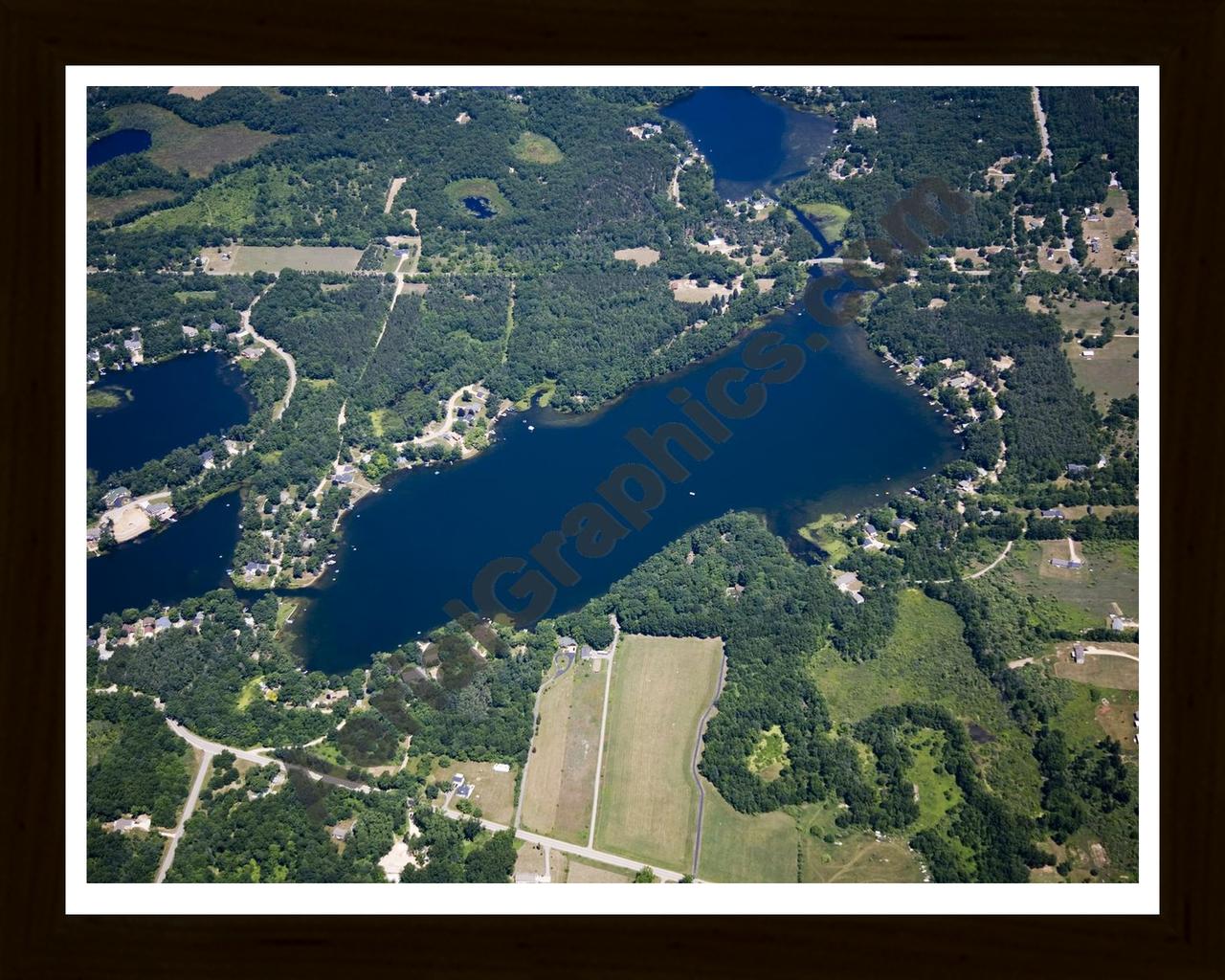 Aerial image of [5014] Woodbeck Lake in Kent, MI with Black Wood frame