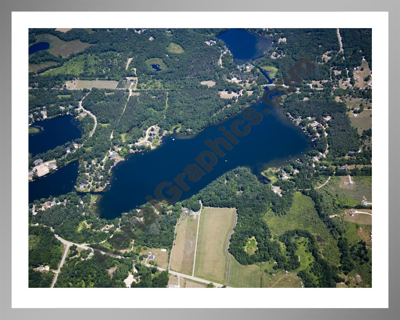 Aerial image of [5014] Woodbeck Lake in Kent, MI with Silver Metal frame