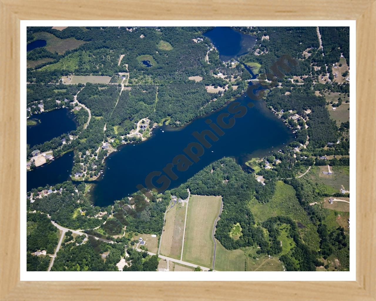 Aerial image of [5014] Woodbeck Lake in Kent, MI with Natural Wood frame