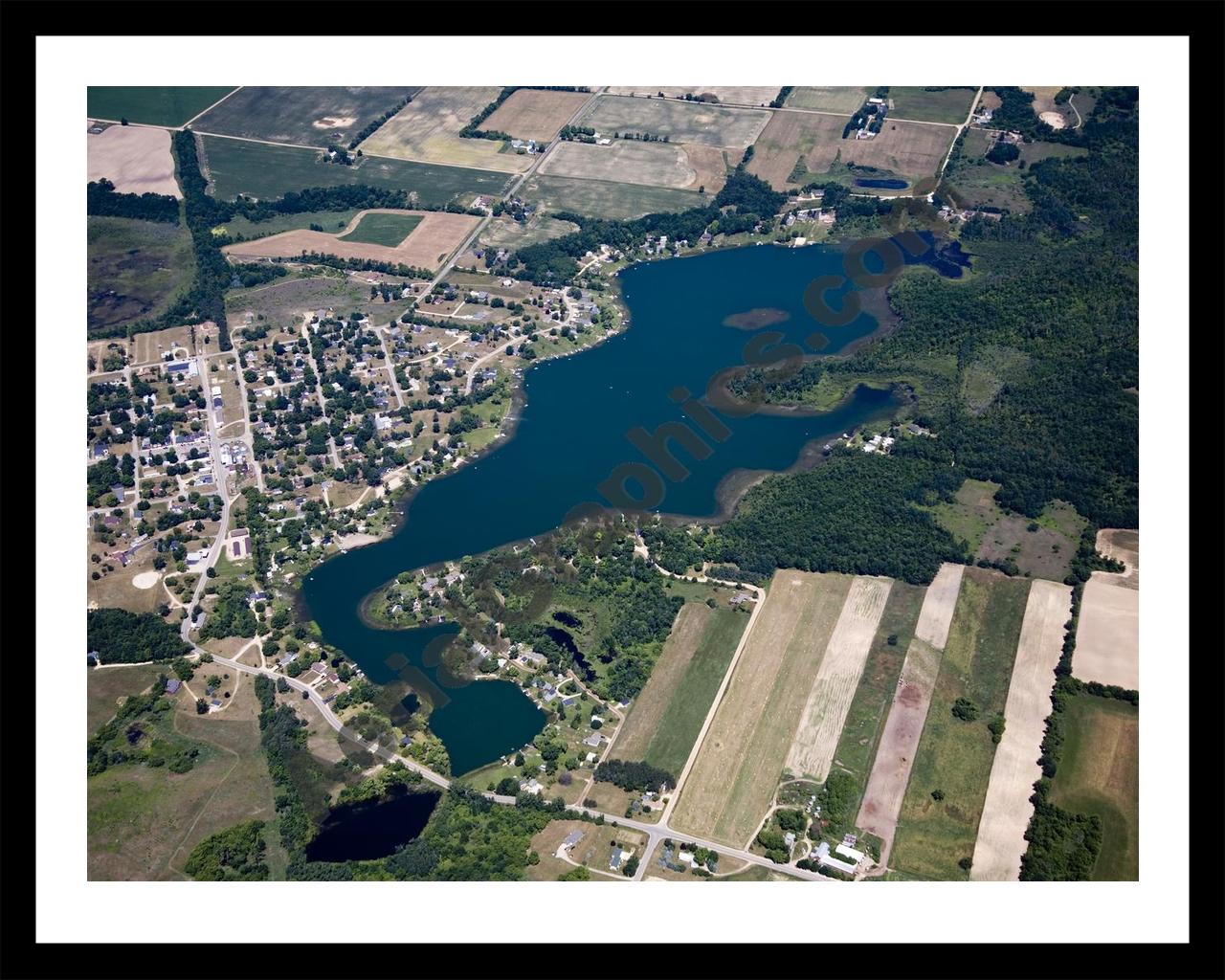 Aerial image of [5022] Muskellunge Lake in Montcalm, MI with Black Metal frame