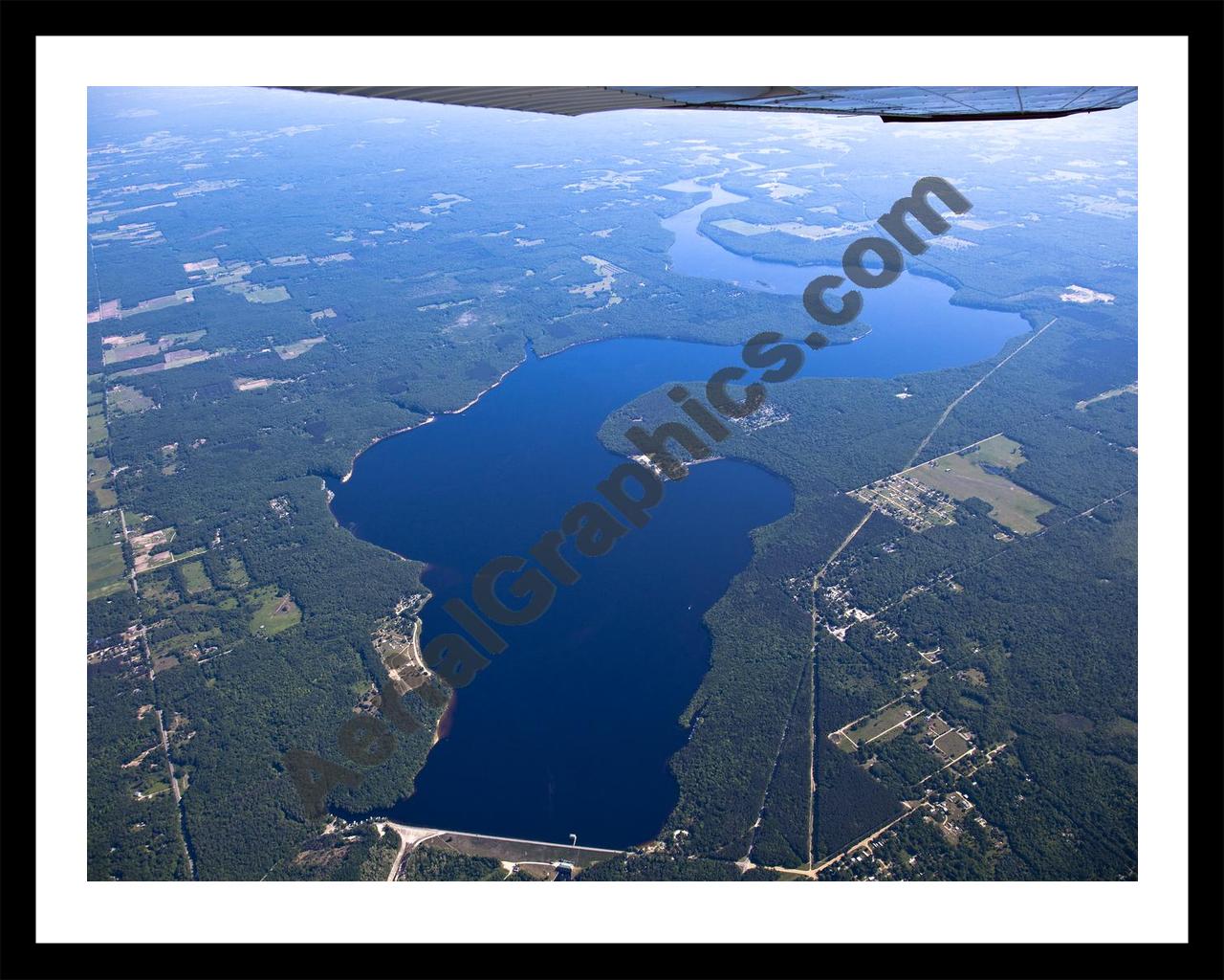 Aerial image of [5504] Hardy Dam Pond in Newaygo, MI with Black Metal frame