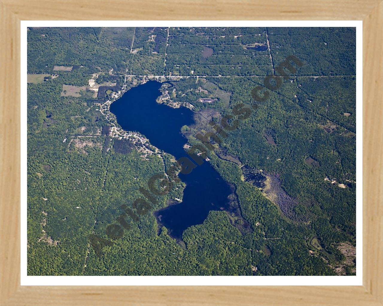 Aerial image of [5516] Lily Lake in Clare, MI with Natural Wood frame