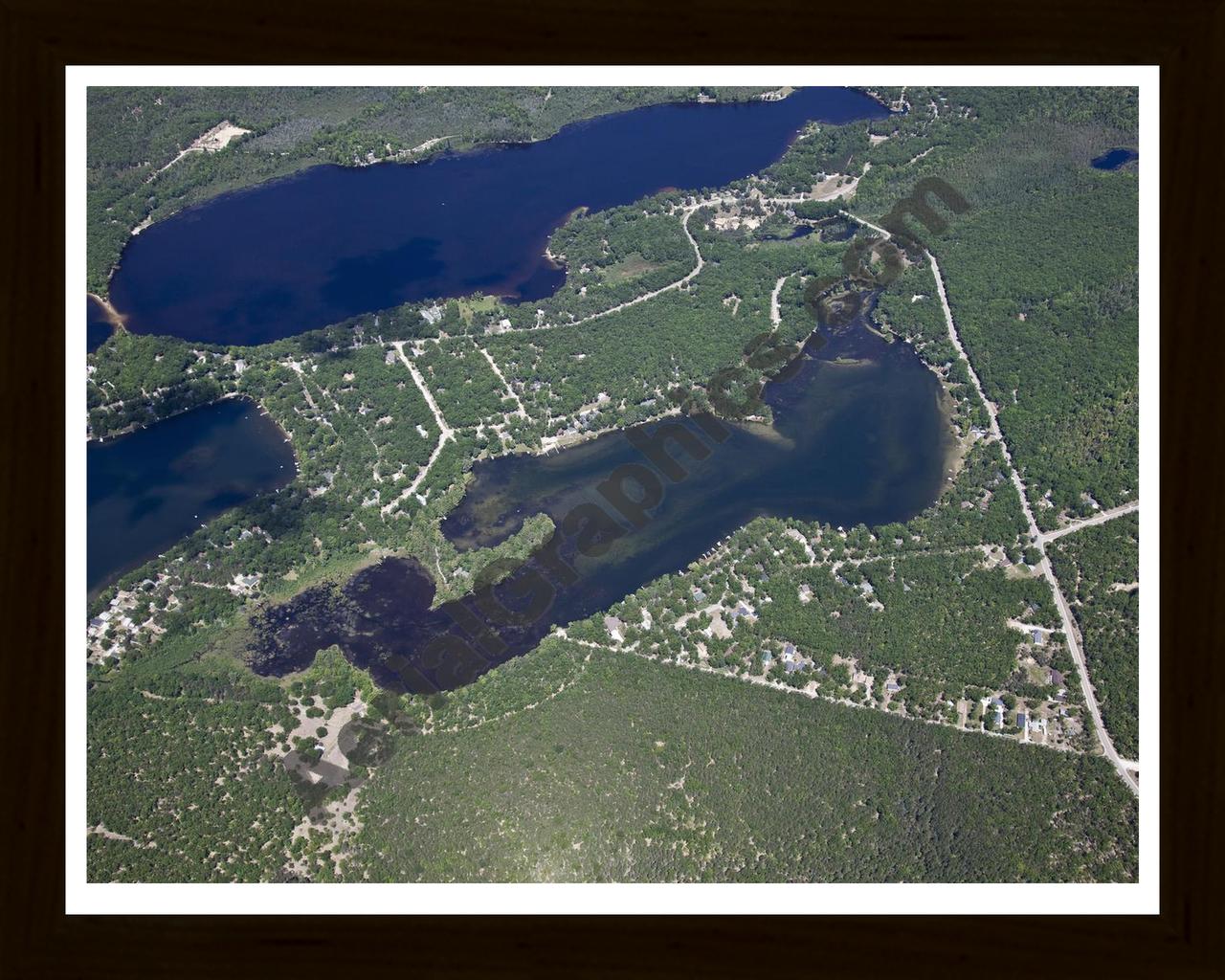 Aerial image of [5542] Island Lake in Iosco, MI with Black Wood frame