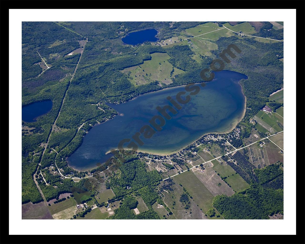 Aerial image of [5560] Munro Lake in Cheboygan, MI with Black Metal frame