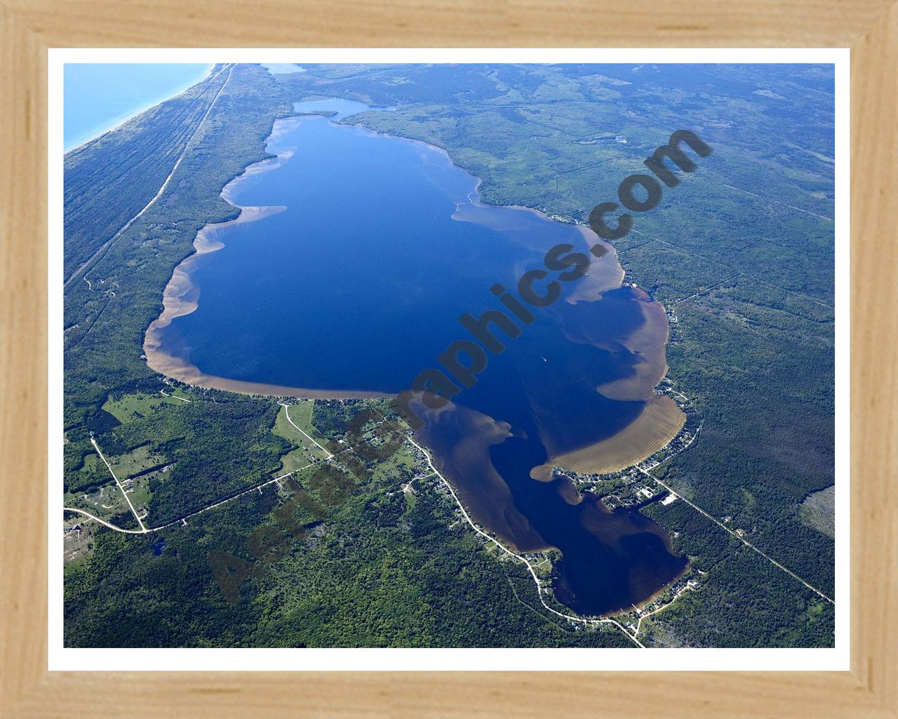 Aerial image of [5563] Brevoort Lake in Mackinac, MI with Natural Wood frame