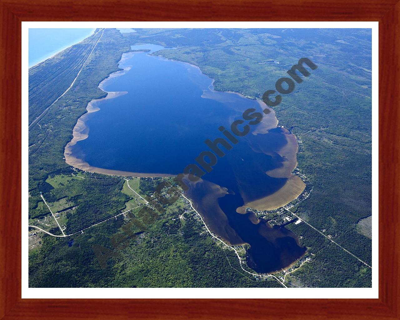 Aerial image of [5563] Brevoort Lake in Mackinac, MI with Cherry Wood frame