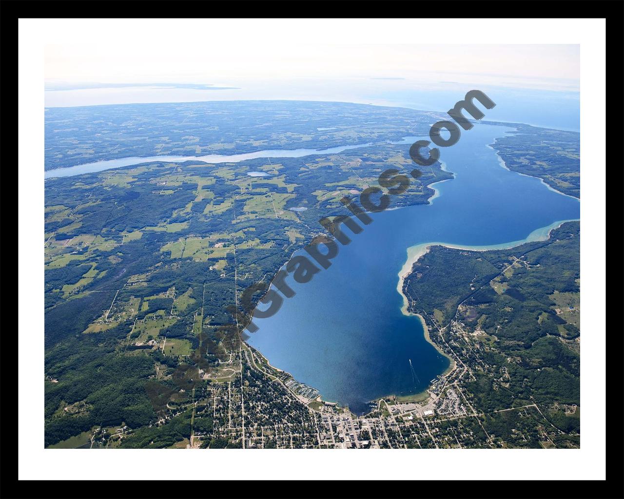 Aerial image of [5565] Lake Charlevoix (Looking West) in Charlevoix, MI with Black Metal frame