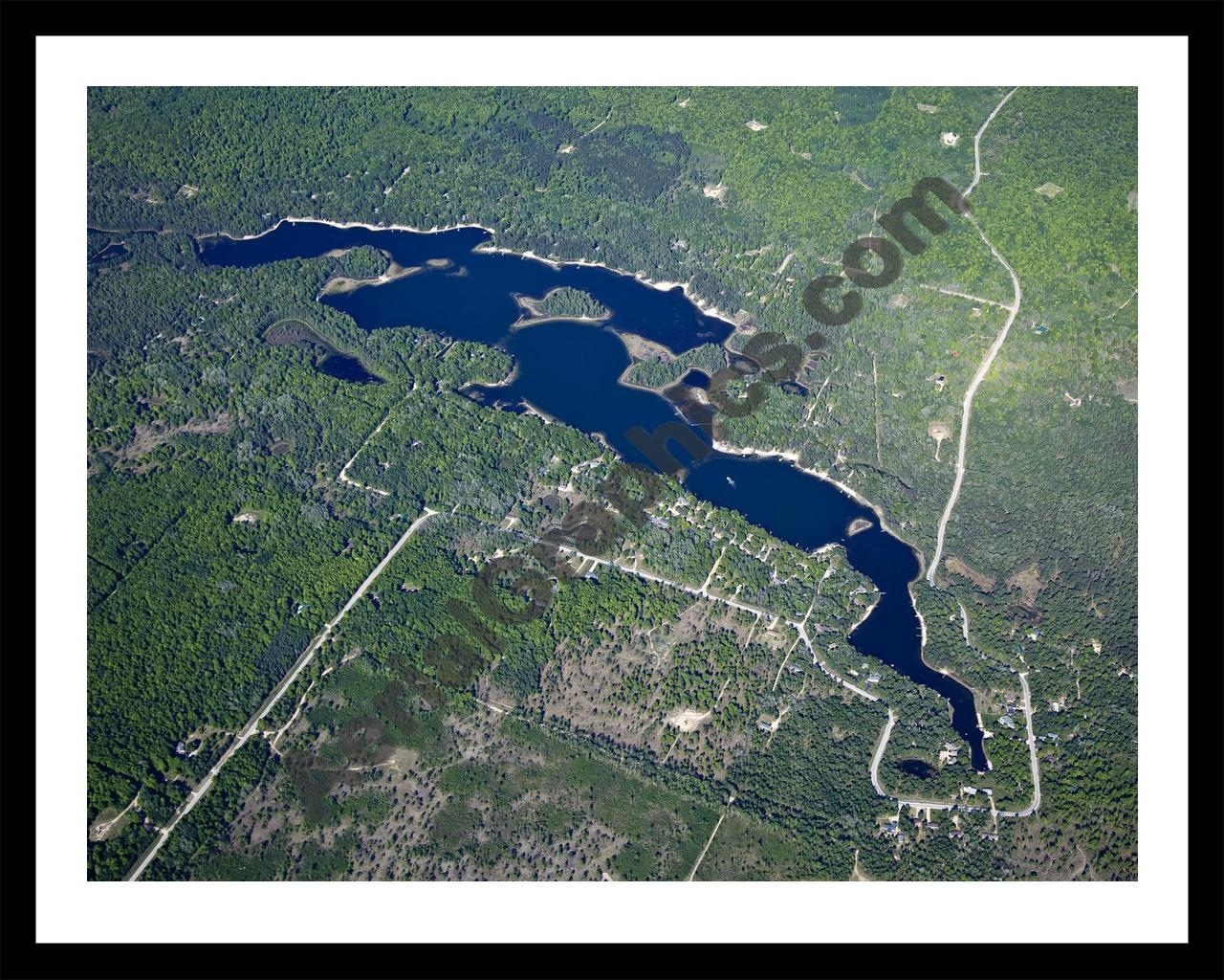 Aerial image of [5568] Lake Manuka in Otsego, MI with Black Metal frame