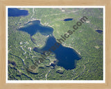 Aerial image of [5576] Little Wolf Lake in Montmorency, MI with Natural Wood frame