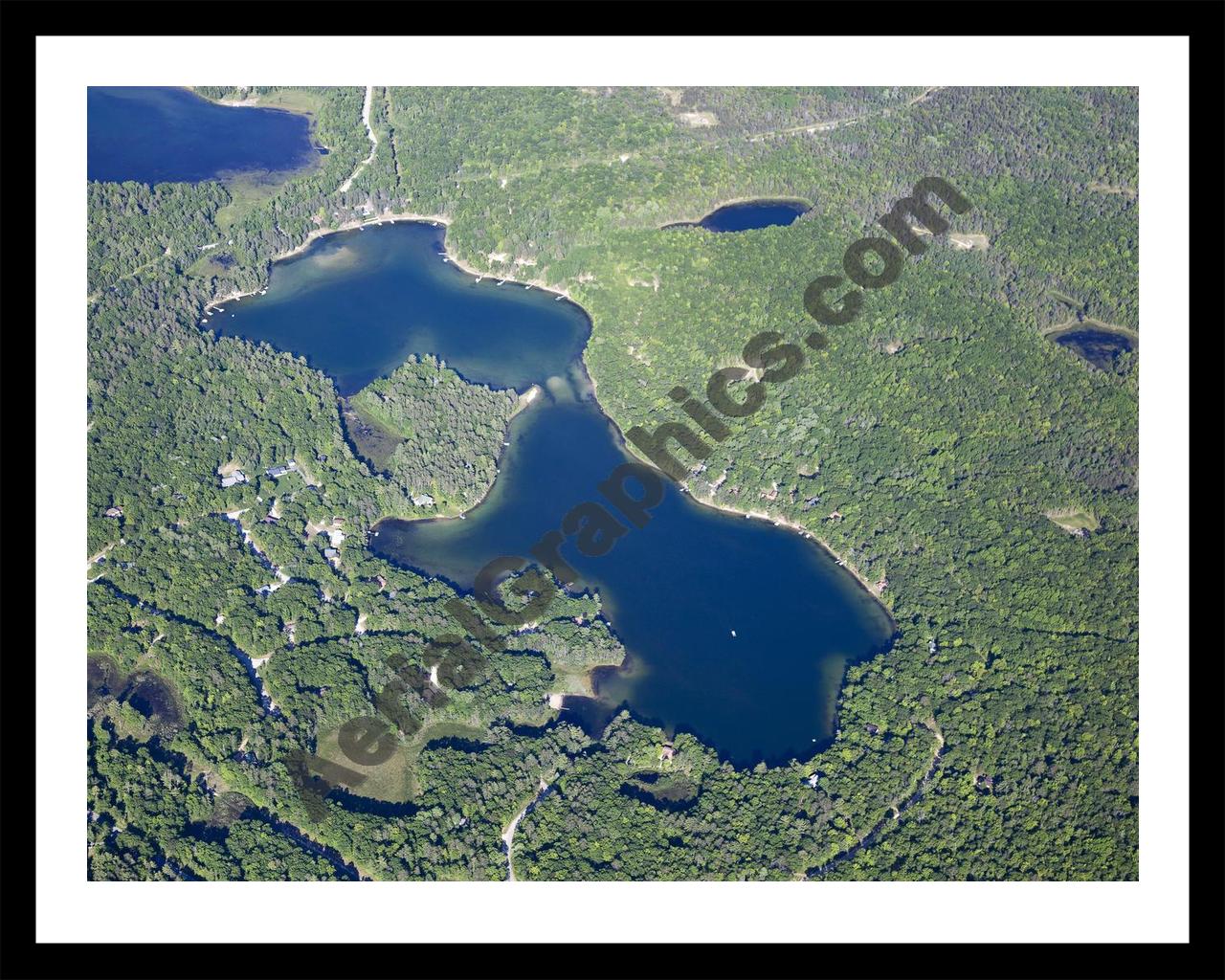 Aerial image of [5576] Little Wolf Lake in Montmorency, MI with Black Metal frame