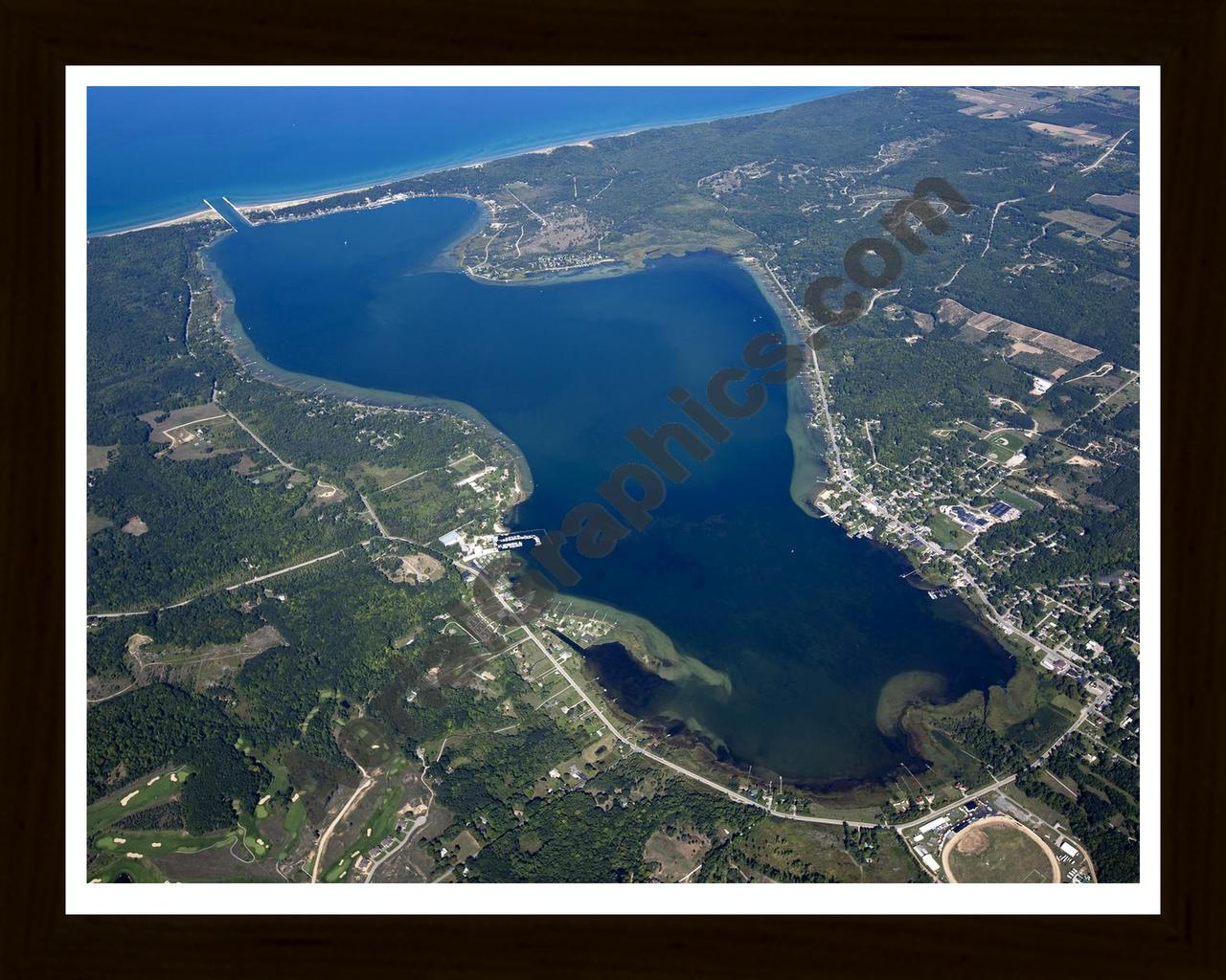 Aerial image of [5590] Portage Lake in Manistee, MI with Black Wood frame