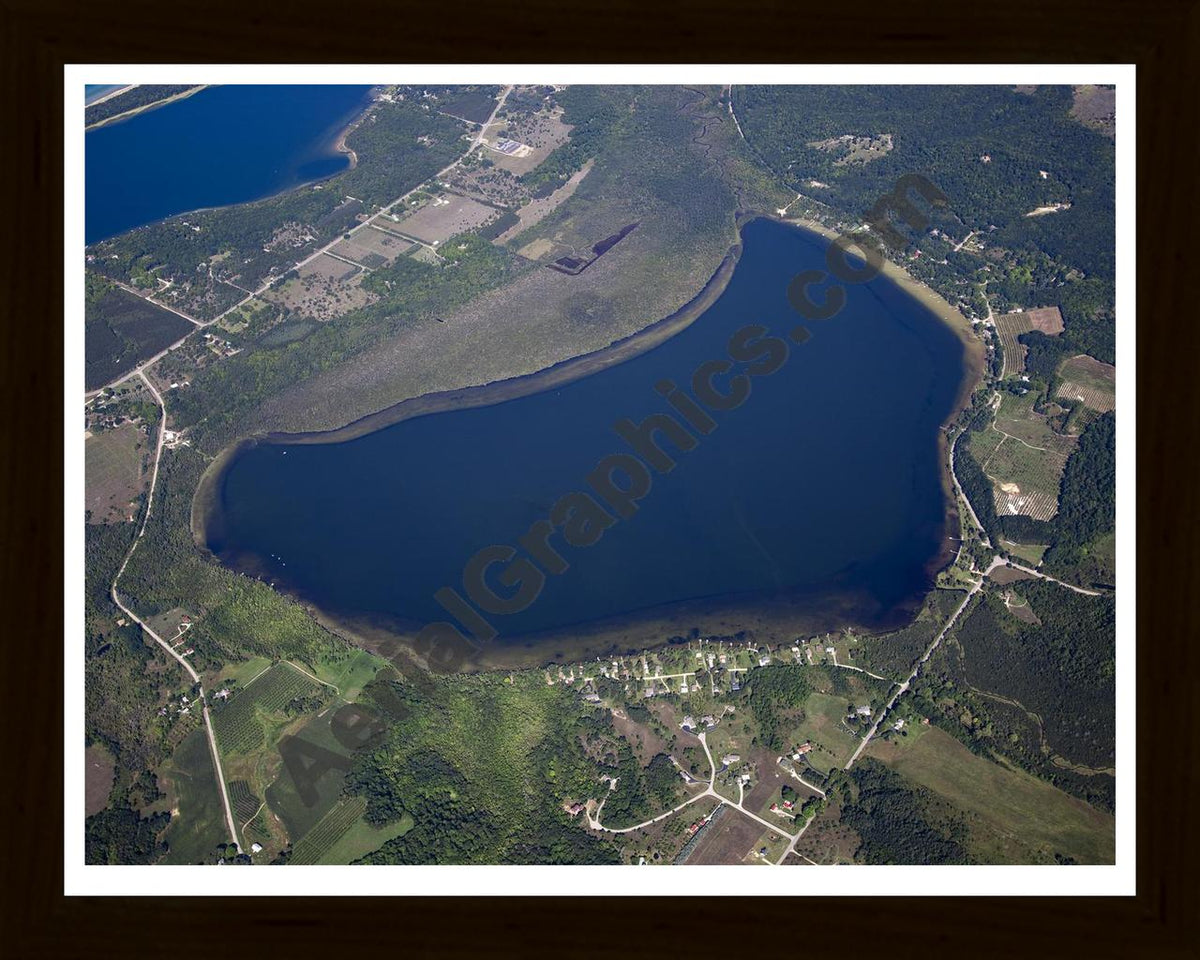 Aerial image of [5594] Upper Herring Lake in Benzie, MI with Black Wood frame