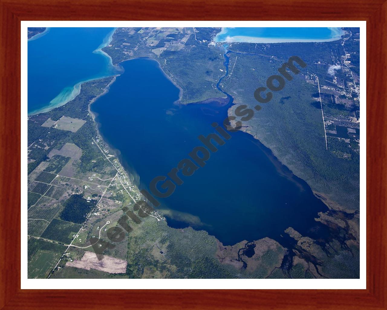 Aerial image of [5600] Lake Skegemog in Grand Traverse, MI with Cherry Wood frame