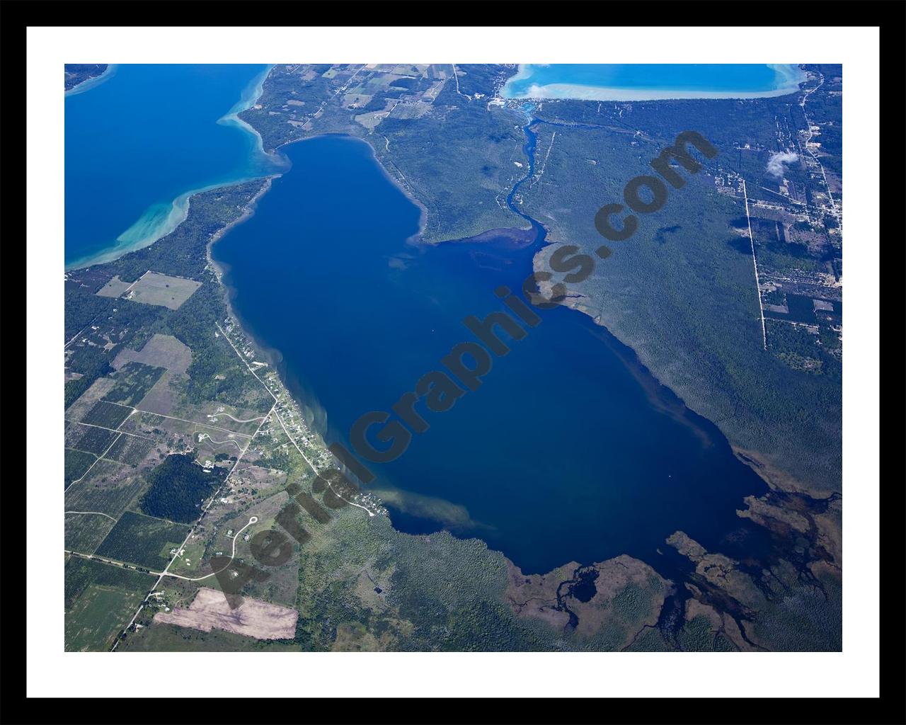 Aerial image of [5600] Lake Skegemog in Grand Traverse, MI with Black Metal frame