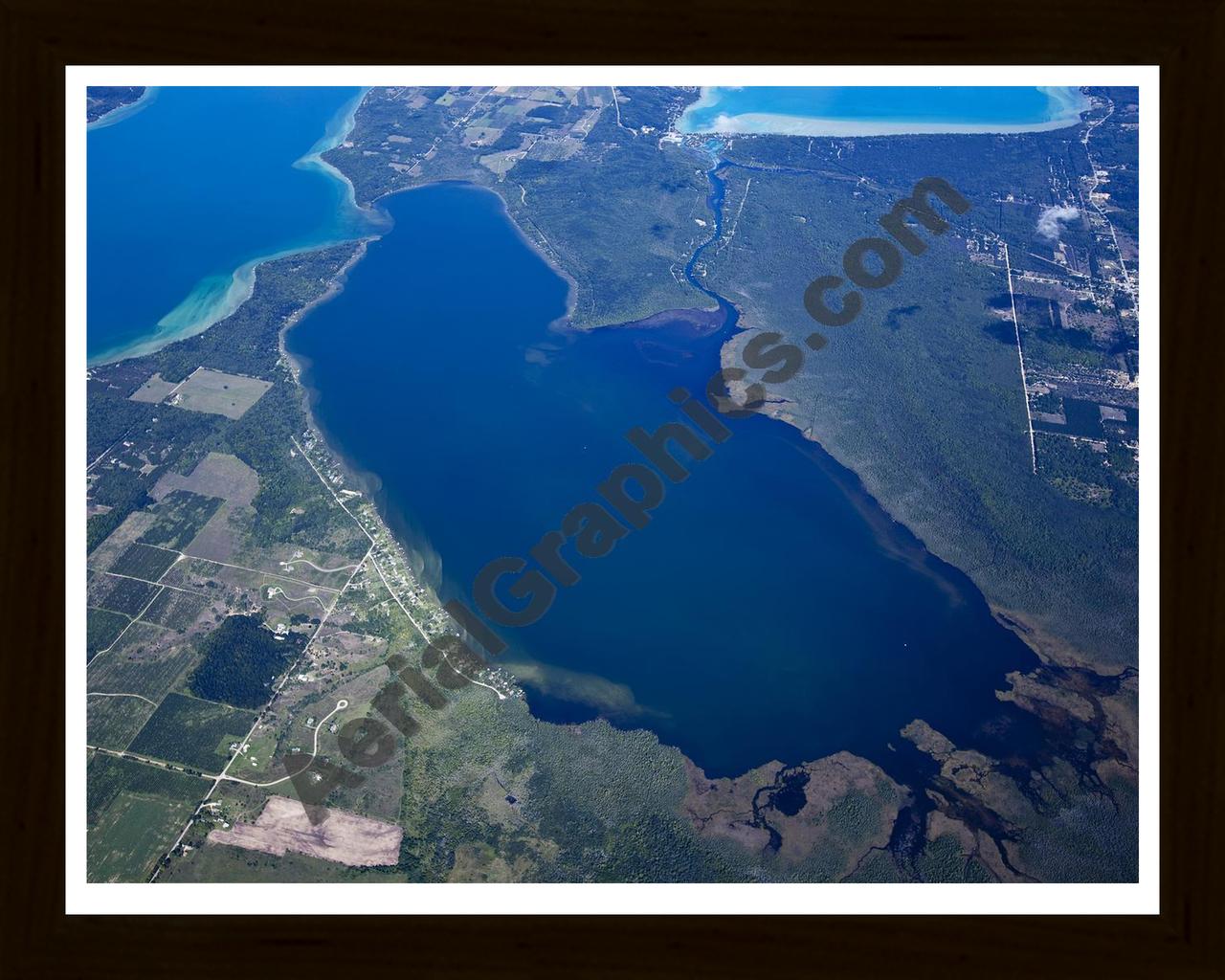 Aerial image of [5600] Lake Skegemog in Grand Traverse, MI with Black Wood frame