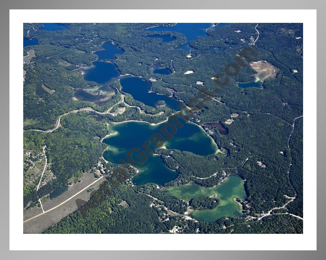 Aerial image of [5604] Arbutus Lake in Grand Traverse, MI with Silver Metal frame