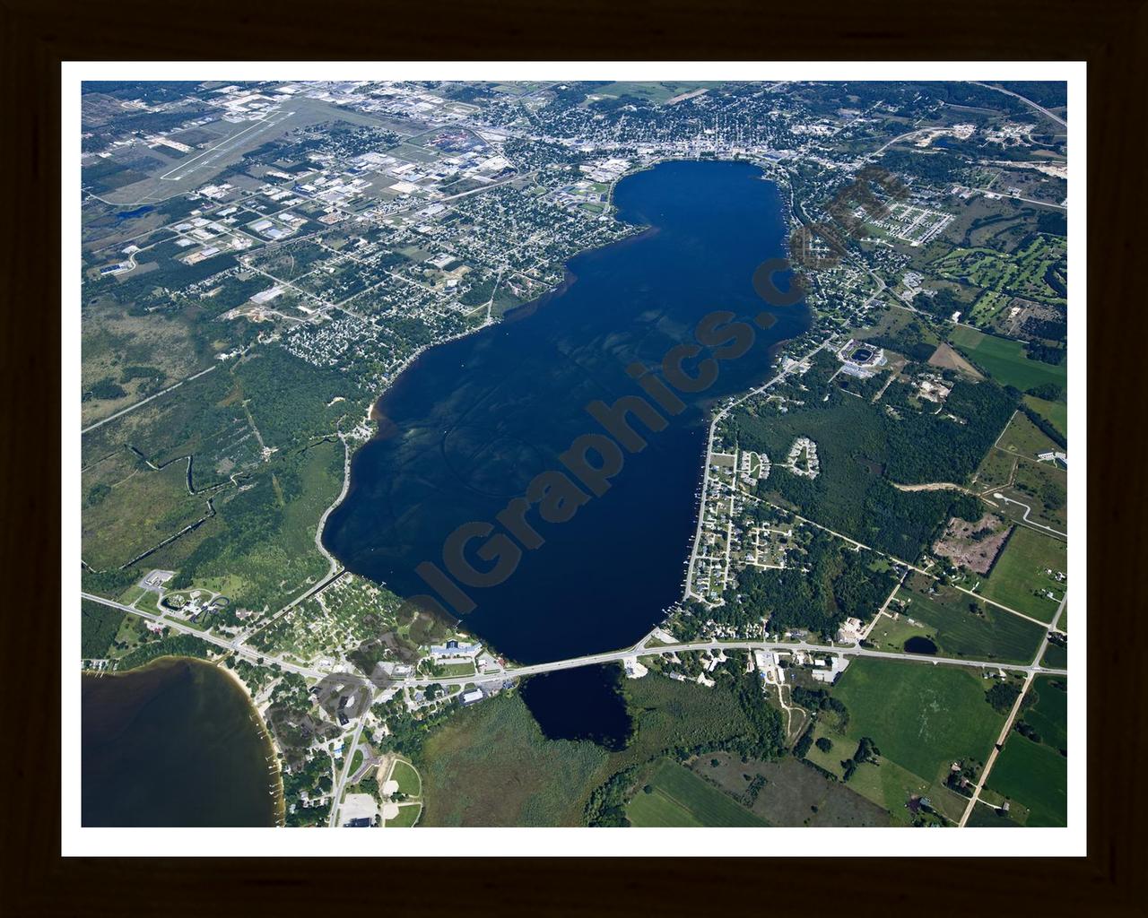 Aerial image of [5611] Lake Cadillac in Wexford, MI with Black Wood frame