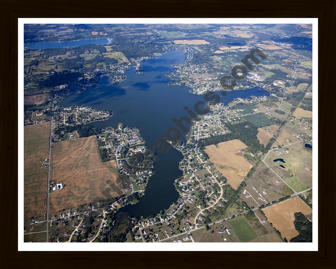 Aerial image of [5647] Columbia Lake in Jackson, MI with Black Wood frame