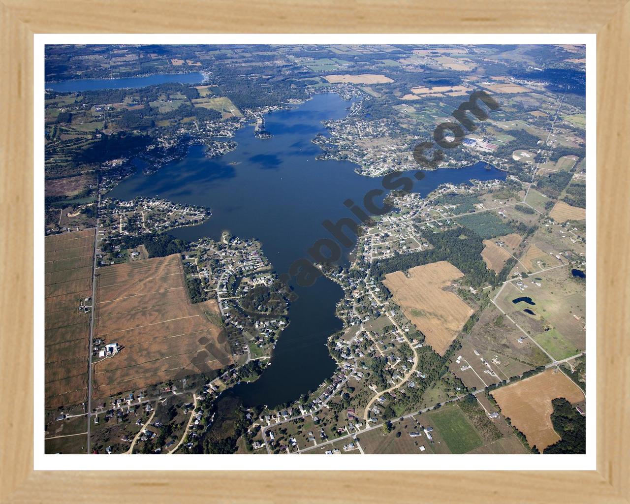 Aerial image of [5647] Columbia Lake in Jackson, MI with Natural Wood frame