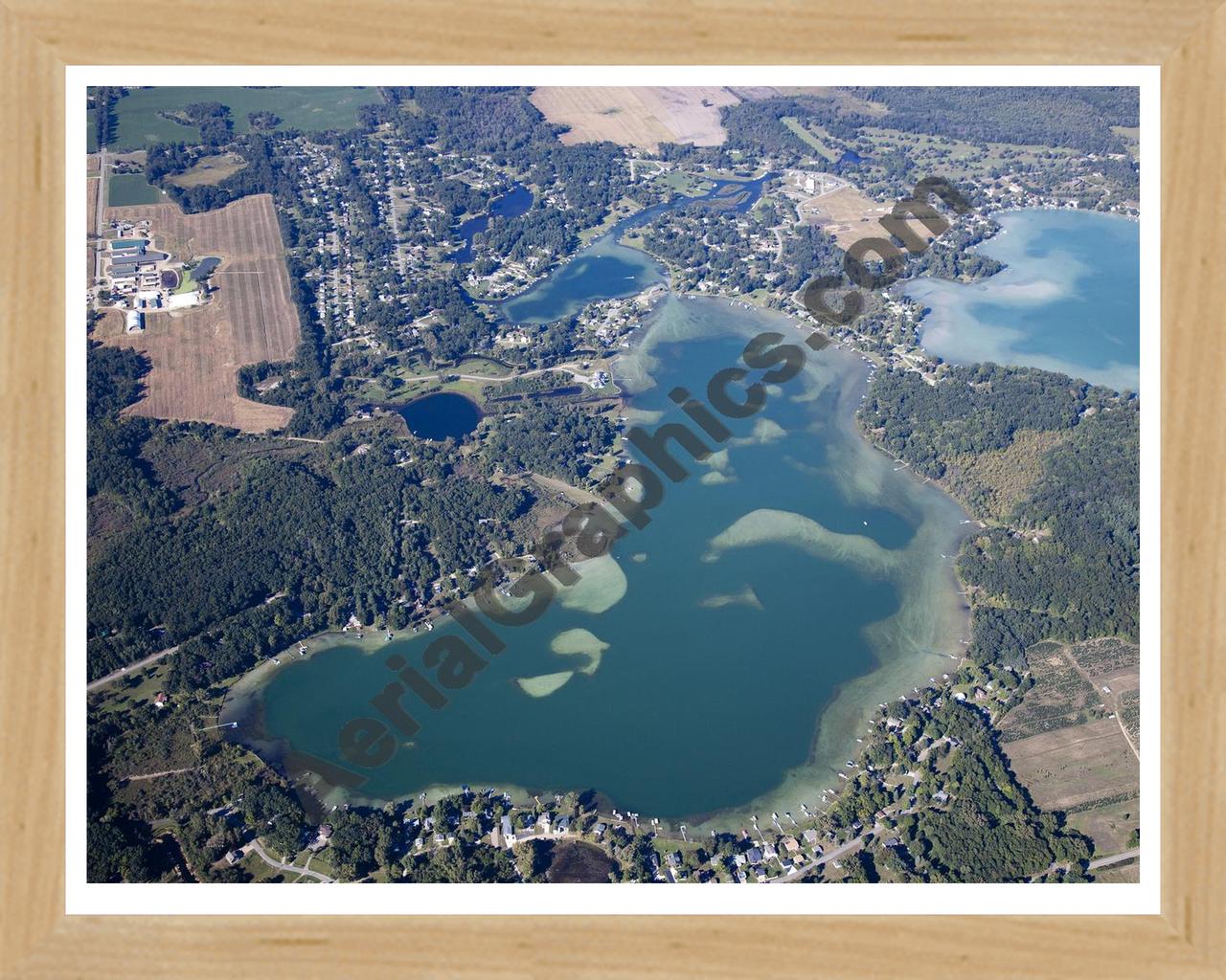 Aerial image of [5651] Farwell Lake in Jackson, MI with Natural Wood frame