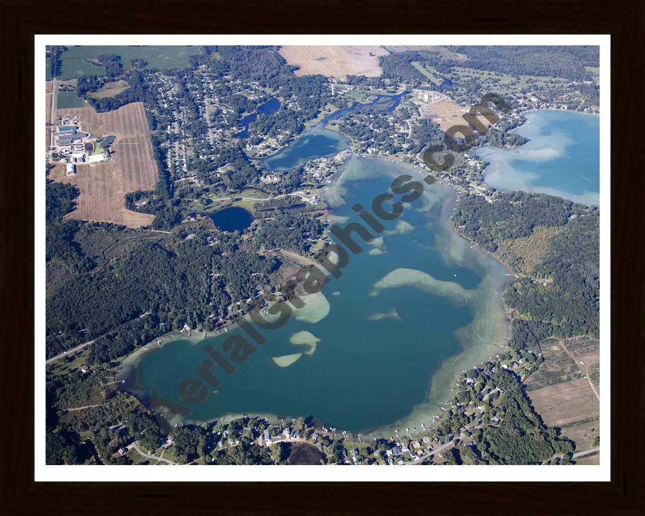 Aerial image of [5651] Farwell Lake in Jackson, MI with Black Wood frame