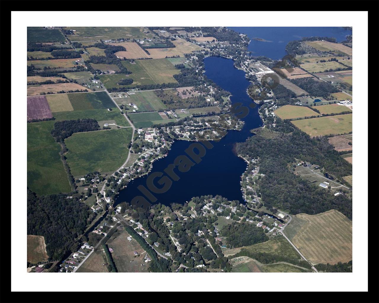 Aerial image of [5653] Lake Bartholomew in Branch, MI with Black Metal frame