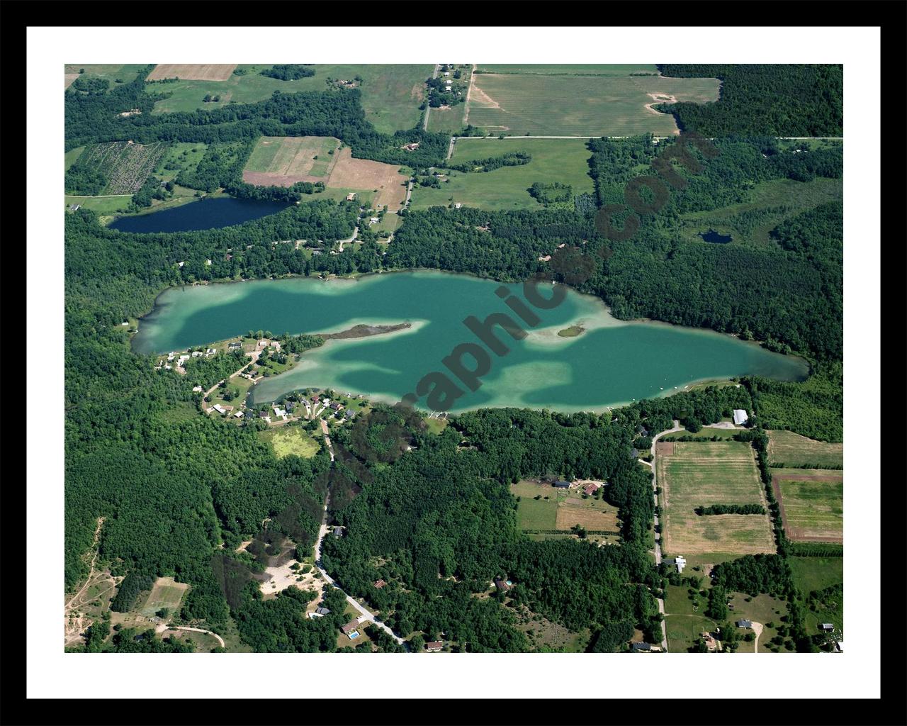 Aerial image of [5678] Burgess Lake in Montcalm, MI with Black Metal frame