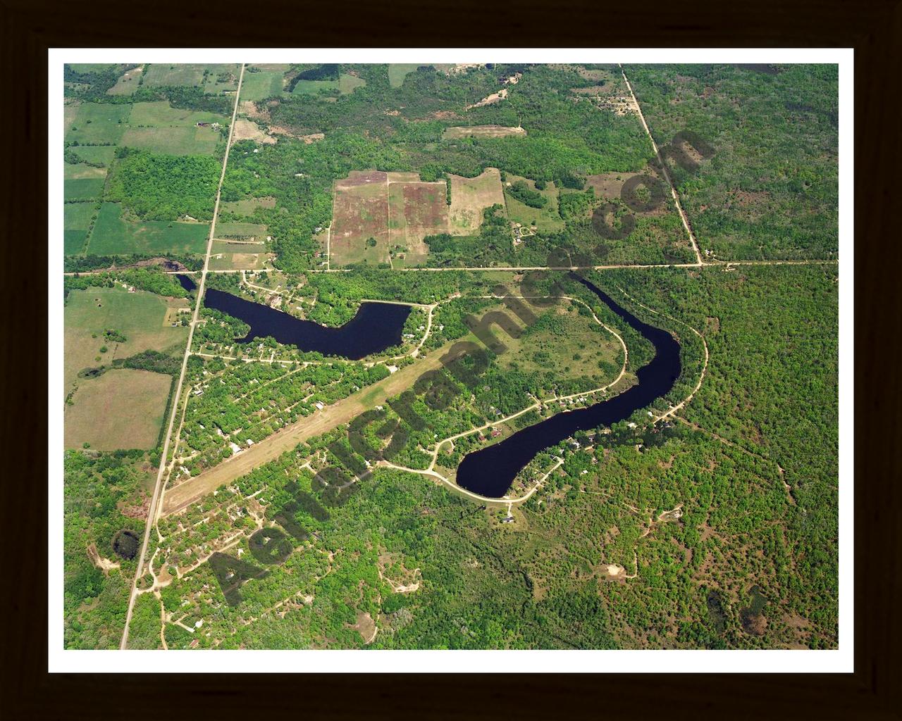 Aerial image of [5701] Lake Windaga in Isabella, MI with Black Wood frame